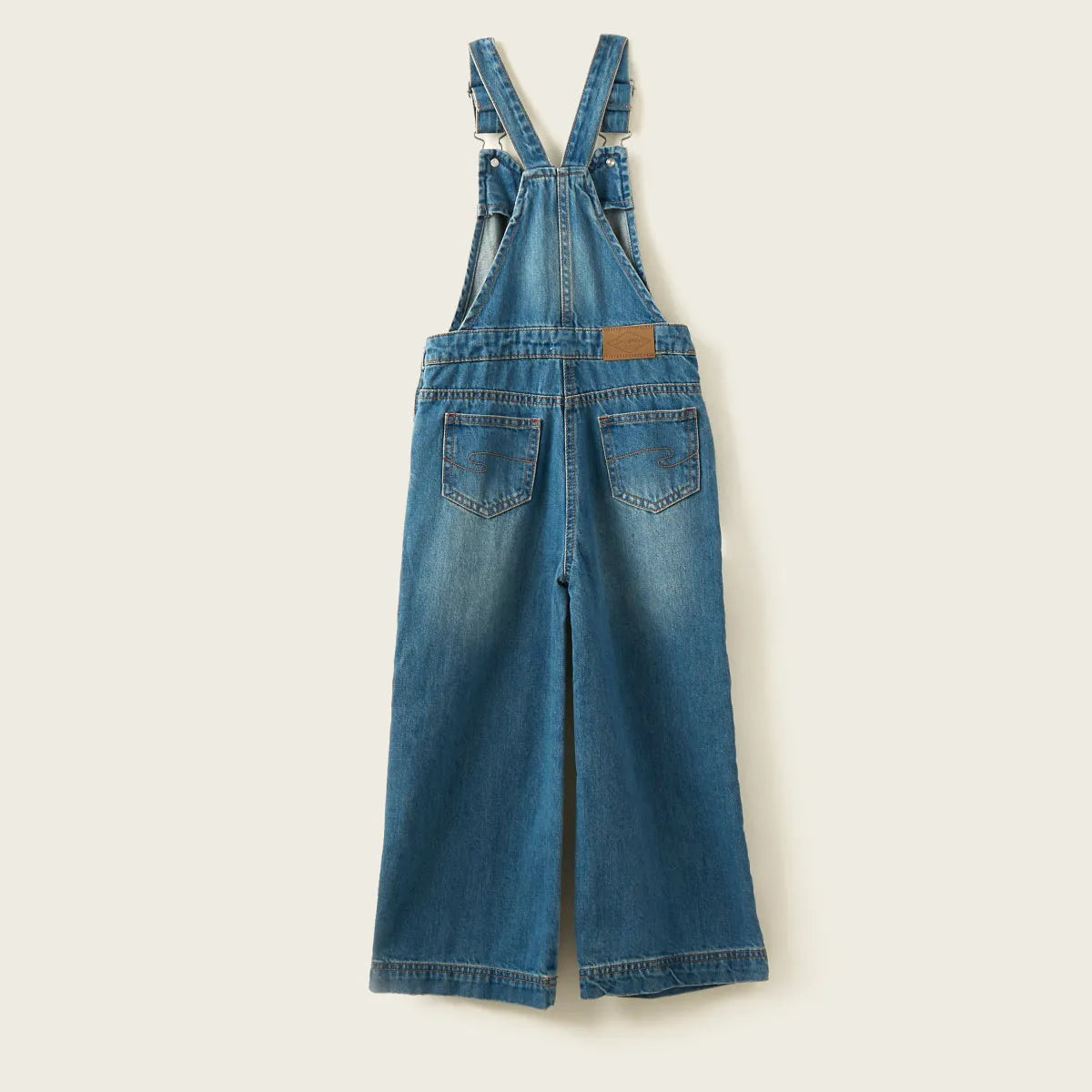 Blue denim overalls with two front thigh pockets and adjustable shoulder straps