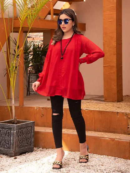 Nazmina red long tunic with round neck and long sleeves, black ripped skinny jeans, relaxed fit