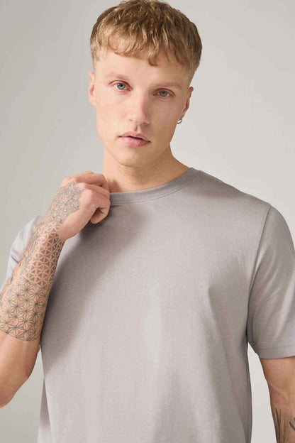 Light gray crew-neck T-shirt with short sleeves, close-up upper chest