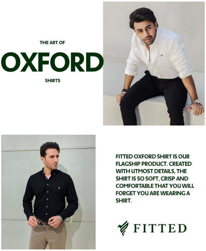White slim-fit button-up shirt worn by model, green chest logo and button placket