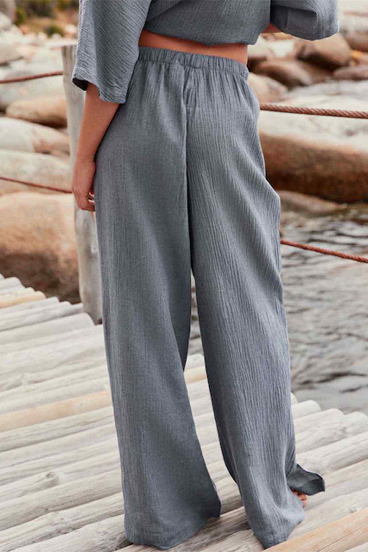 Slate grey wide-leg pants with relaxed straight legs, full length