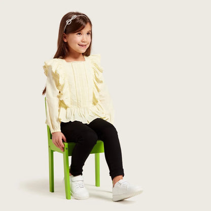 Kids clothing set: pale yellow ruffled blouse with black leggings