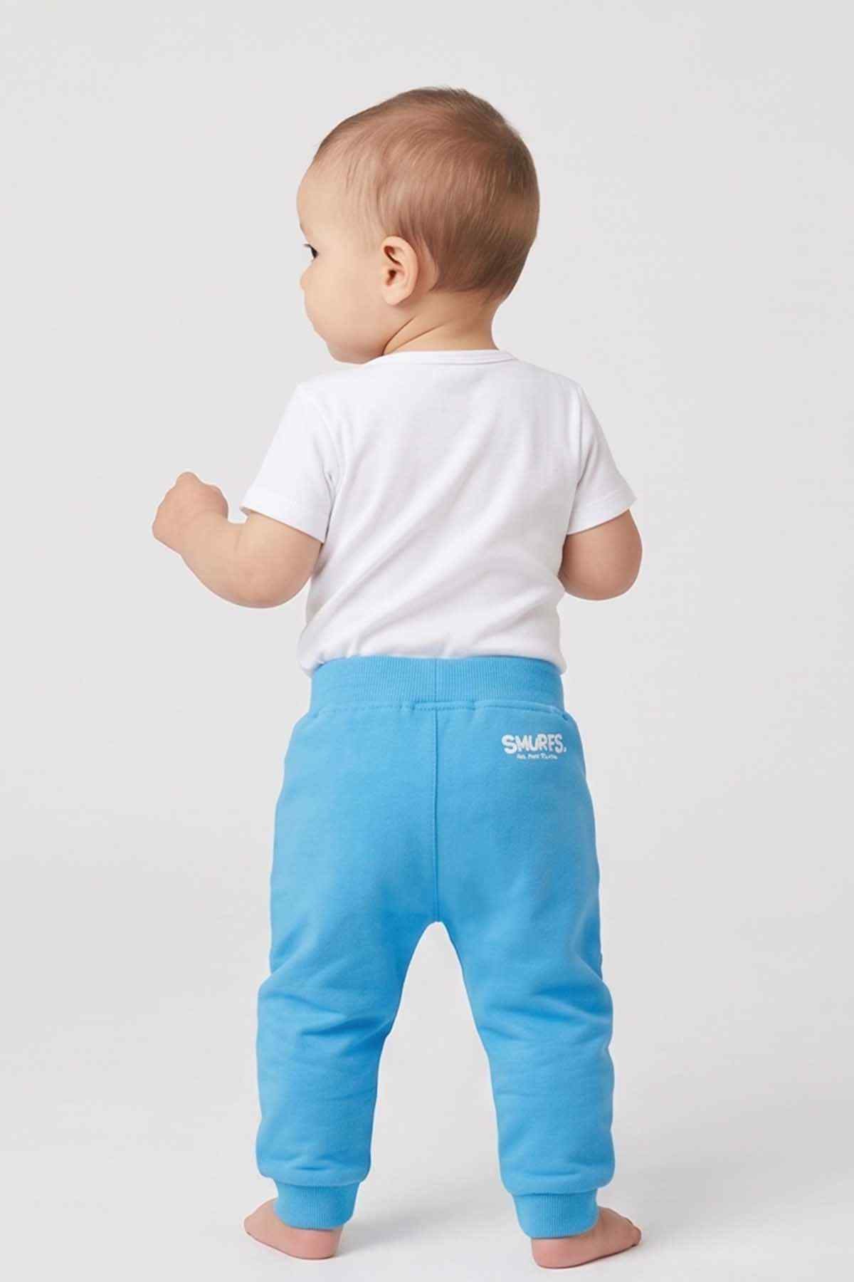 Blue baby jogger pants, back view with Smurfs logo patch