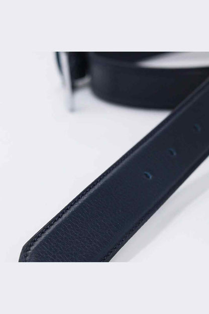 Dark blue leather belt strap with punched holes detail