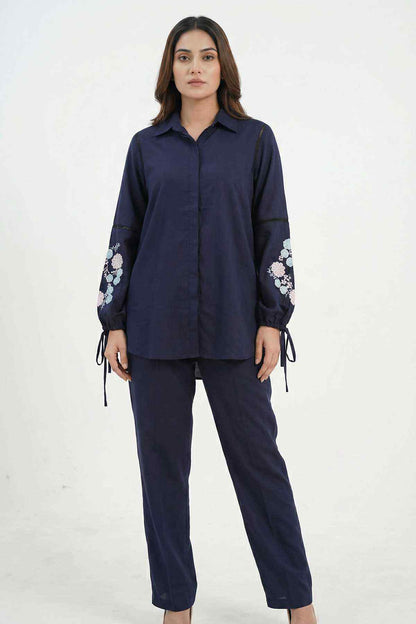 Navy blue tunic shirt and matching pants set with floral embroidery and tied cuffs