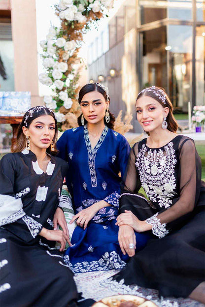 Black embroidered long dress with sheer sleeves, floral neckline design, worn with headband