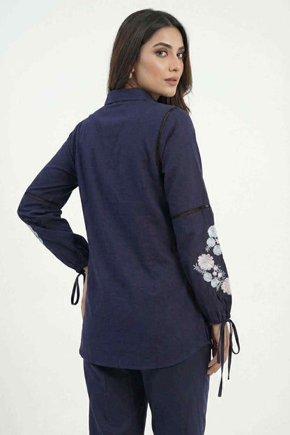 Navy blue tunic shirt and pants set, back/side view with embroidered sleeve details