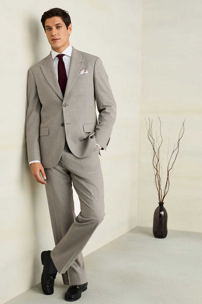 Men's light gray suit with matching trousers, two-button blazer and dress tie.