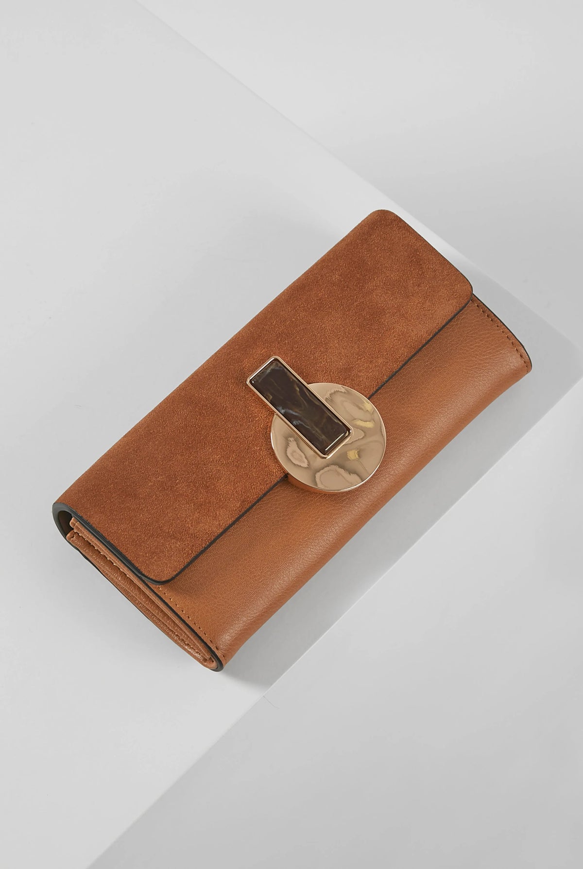 Brown leather wallet with hinged clasp and front pocket