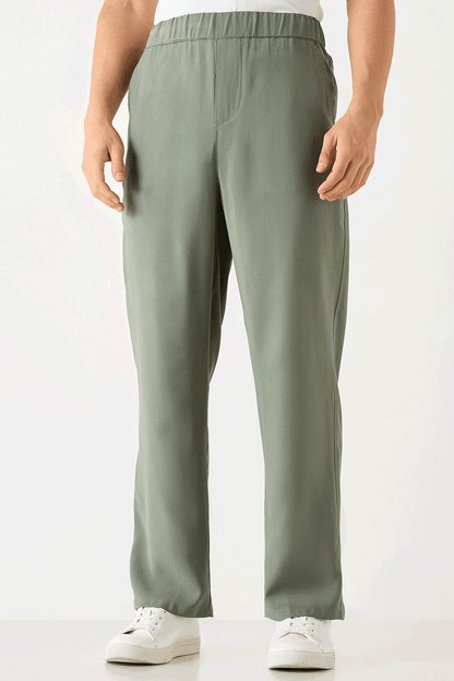Men's sage green elastic-waist trousers, side view