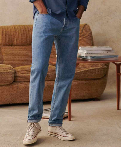 Fitted light-wash denim jeans with cuffed hems and five-pocket design
