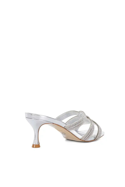 Silver heeled sandal with rhinestone straps and slender metallic heel