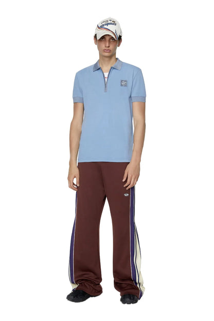 Light blue polo shirt with half-zip placket, chest patch, and ribbed hem