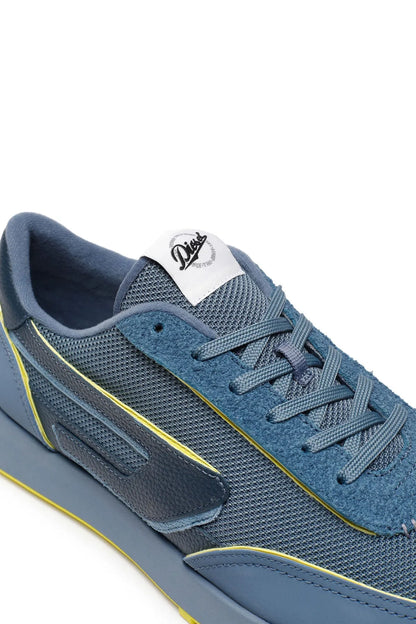 Diesel blue sneaker close-up with lace-up eyelets, side logo and yellow piping