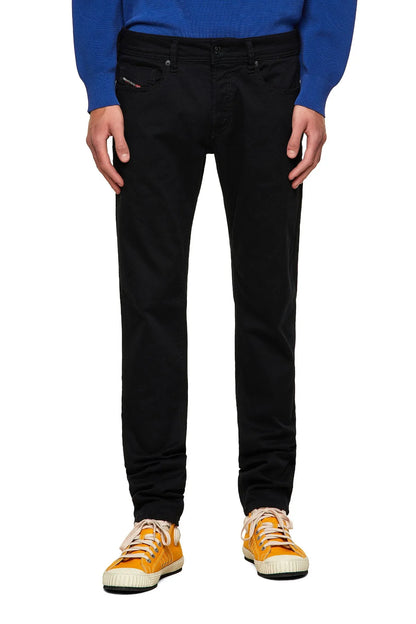 Black jeans front view with button closure, belt loops, and tapered legs