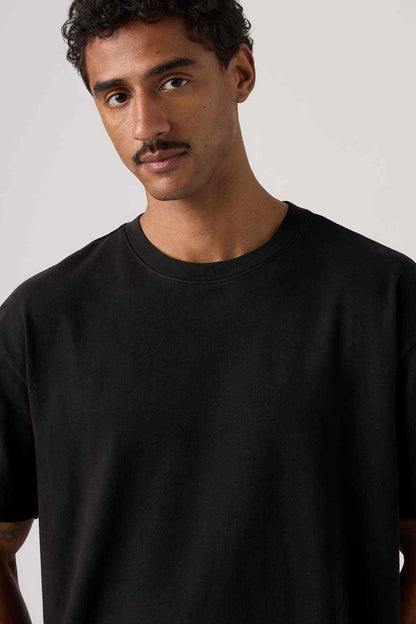 Men's black crewneck T-shirt close-up on collar and chest