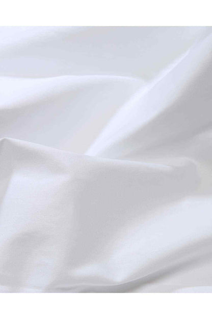 White dress shirt fabric close-up with smooth texture