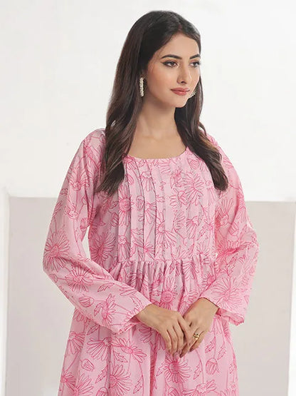 Pink printed maxi dress close-up: square neckline, gathered bodice, long sleeves