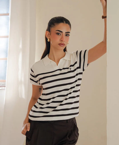 Fitted striped polo shirt with collared neckline and black stripe bands across the chest