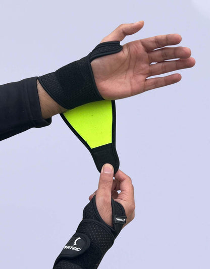 Bodybrics black wrist wrap brace with open palm cutout and thumb loop
