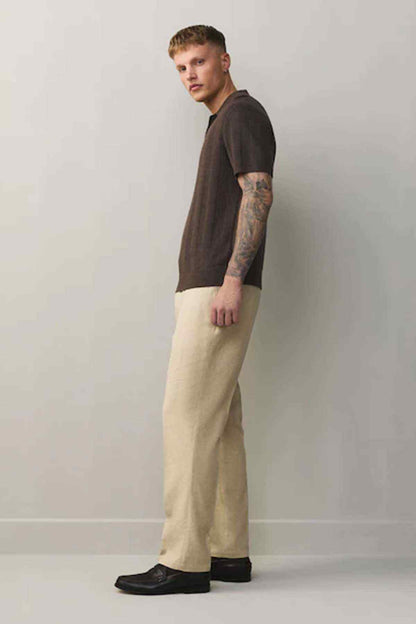 Stone straight-leg trousers, side view with belt loops and button fly