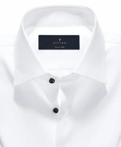 White fitted dress shirt close-up of button placket and spread collar