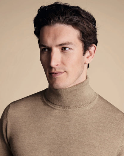 Mens wool turtleneck sweater in neutral beige, ribbed collar and cuffs