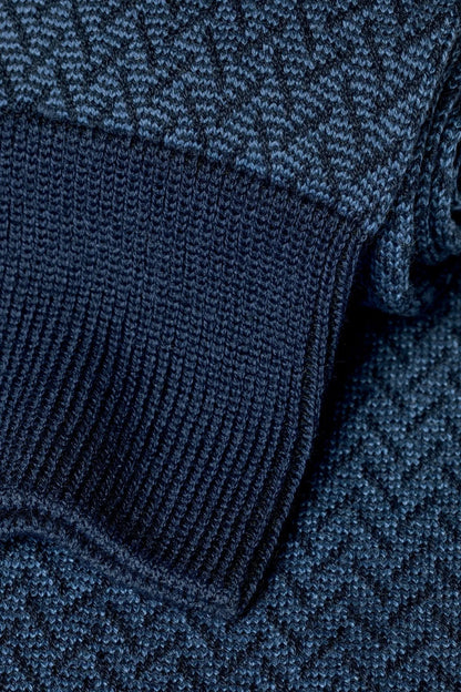 Blue patterned knit socks with ribbed cuff and textured weave detail