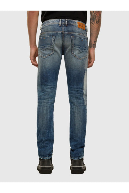 Blue denim jeans with rear and front pockets, button closure, and straight legs