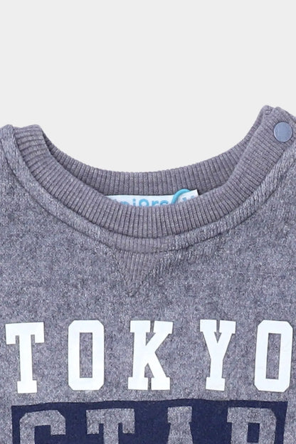 Blue baby sweatshirt neckline with TOKYO lettering close-up