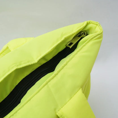 Lime green tote bag interior close-up showing black zipper and seam trim