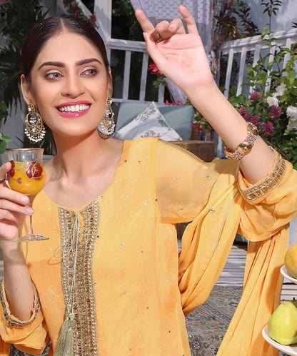 Yellow embroidered tunic with decorative neckline, sheer dupatta, bangles