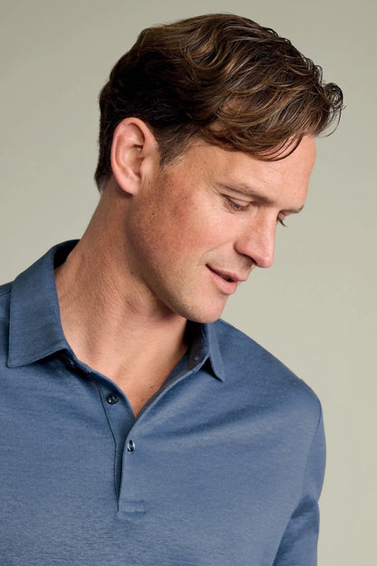 Blue polo shirt collar and placket with three-button opening