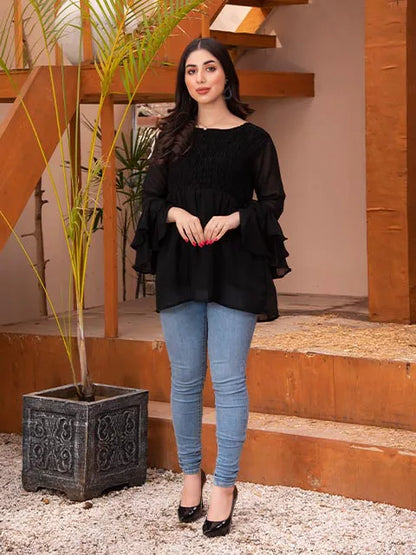 Black tiered ruffle tunic top with round neck and wide, flared sleeves