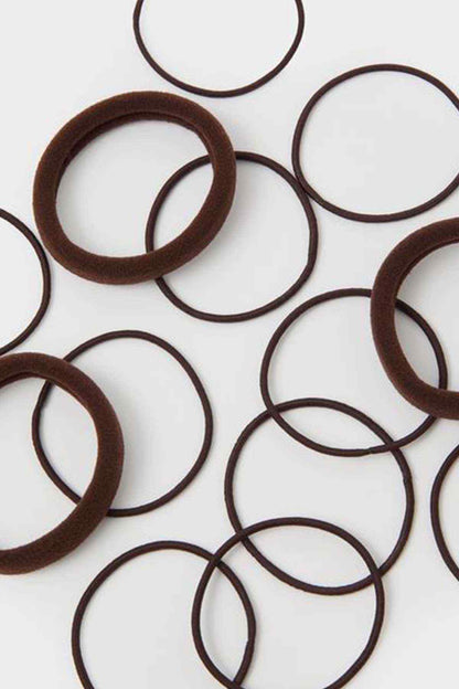 Brown circular ring accessory, close-up of overlapping hoop rings