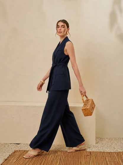 Navy sleeveless V-neck wrap waistcoat with tie belt and wide-leg trousers