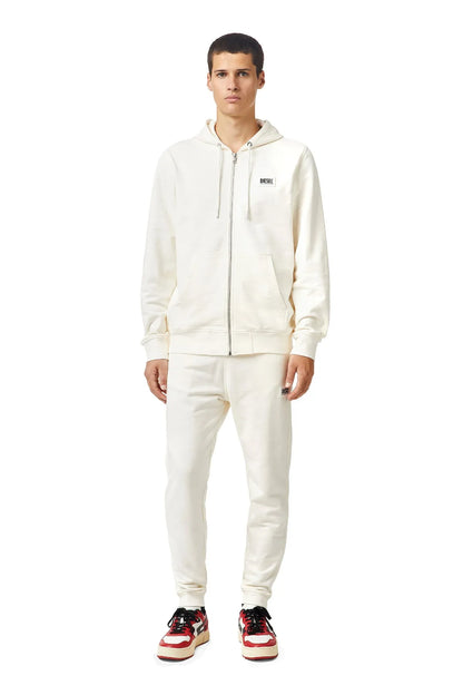 Diesel white zip-up hoodie and pants set, sneakers visible, hood with drawstrings