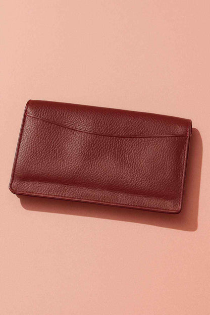 Burgundy leather wallet clutch with smooth front panel and flap