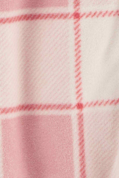 Pink and white plaid knit fabric close-up with red grid lines