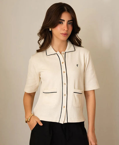 Ivory fitted short-sleeve button-up top with stand collar, contrast trim, and pockets.