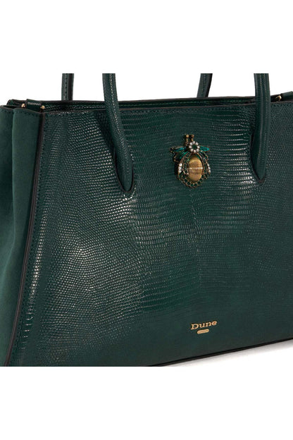 Dune London green textured handbag close-up with bee charm and small logo tab