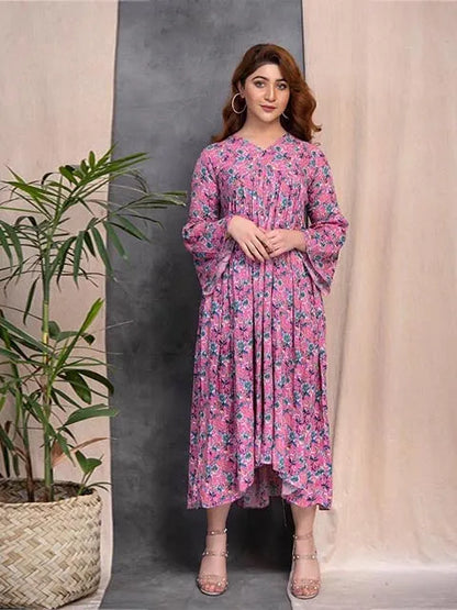 Pink floral long-sleeve midi dress with V-neck; front view standing with relaxed pose