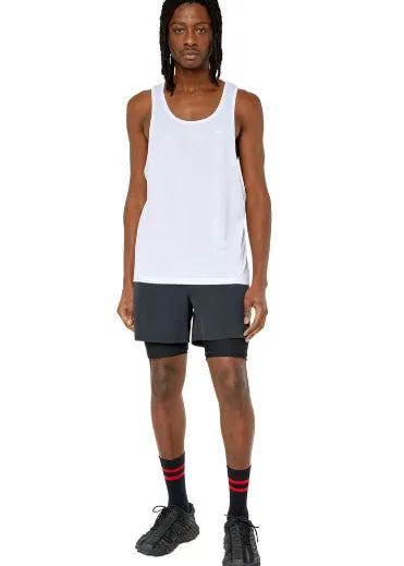 White Diesel sleeveless tank top with chest logo, paired with dark shorts