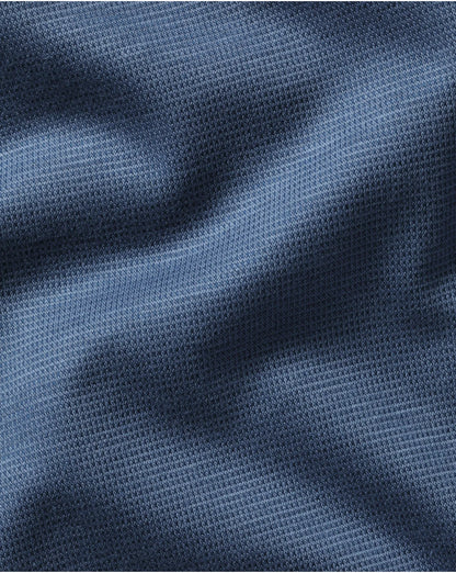 Blue textured polo fabric close-up