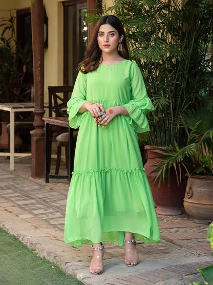 Round-neck green tiered midi dress with flared, ruffled cuffs