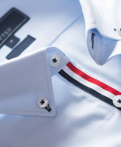 Light blue dress shirt close-up: striped seam and button cuffs