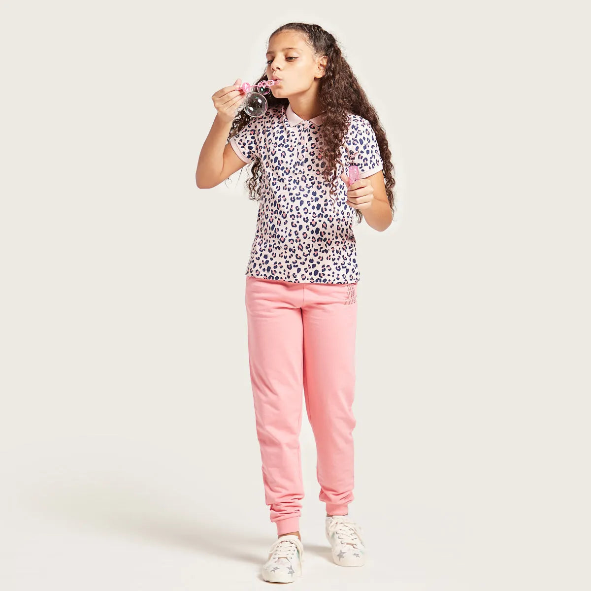 Kids leopard-print t-shirt with pink trim and pink jogger pants, full body