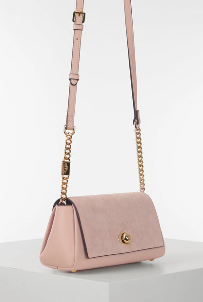 Pink shoulder bag with leather top handle and gold chain accents, front flap
