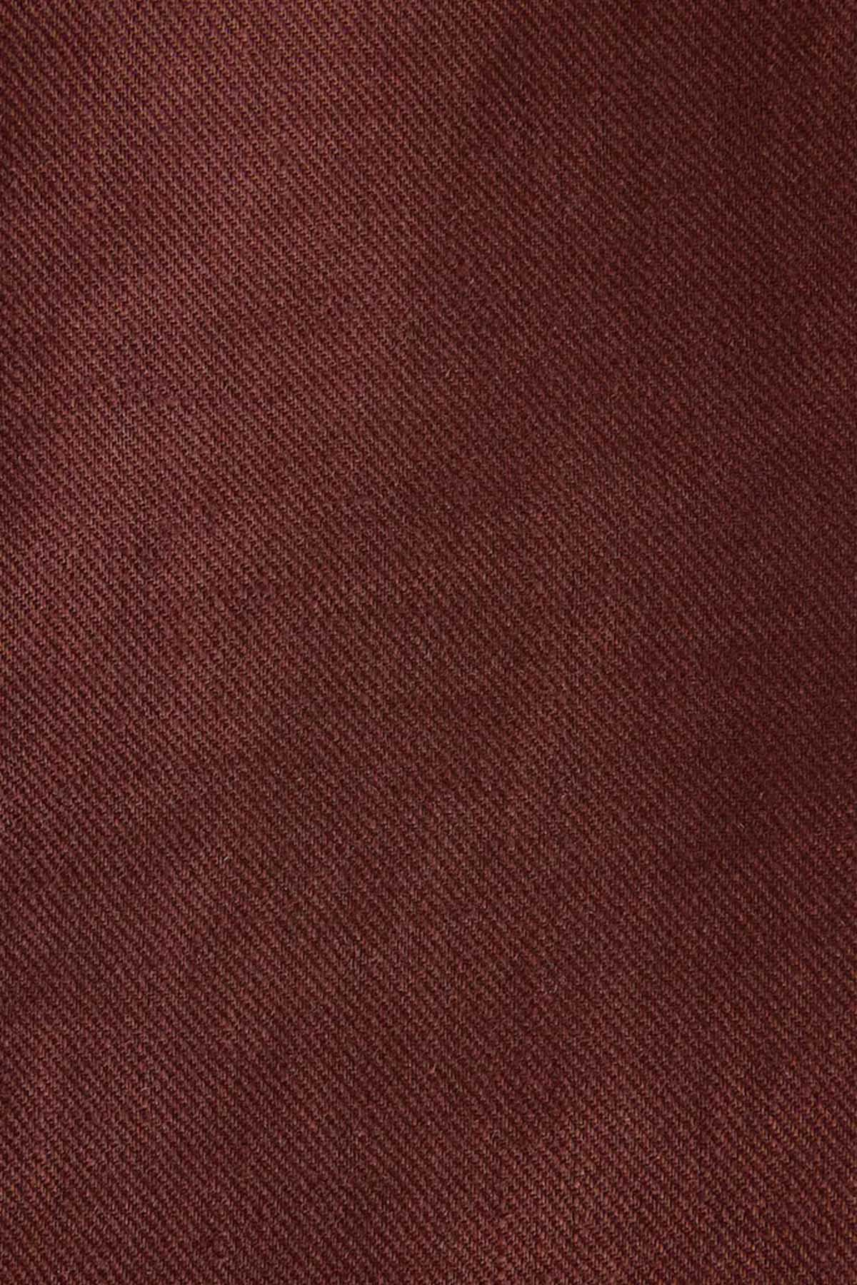 Brown textured suit fabric close-up with fine woven pattern