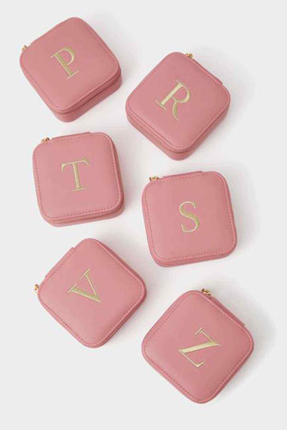 Pink square mini jewelry pouches with gold monogram letters